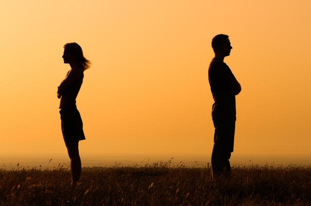 Silhouette of man and women turned away from each other - dealing with marriage separation